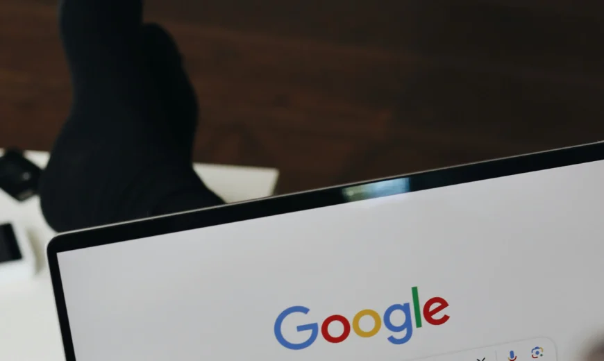 A guy using google search engine on laptop