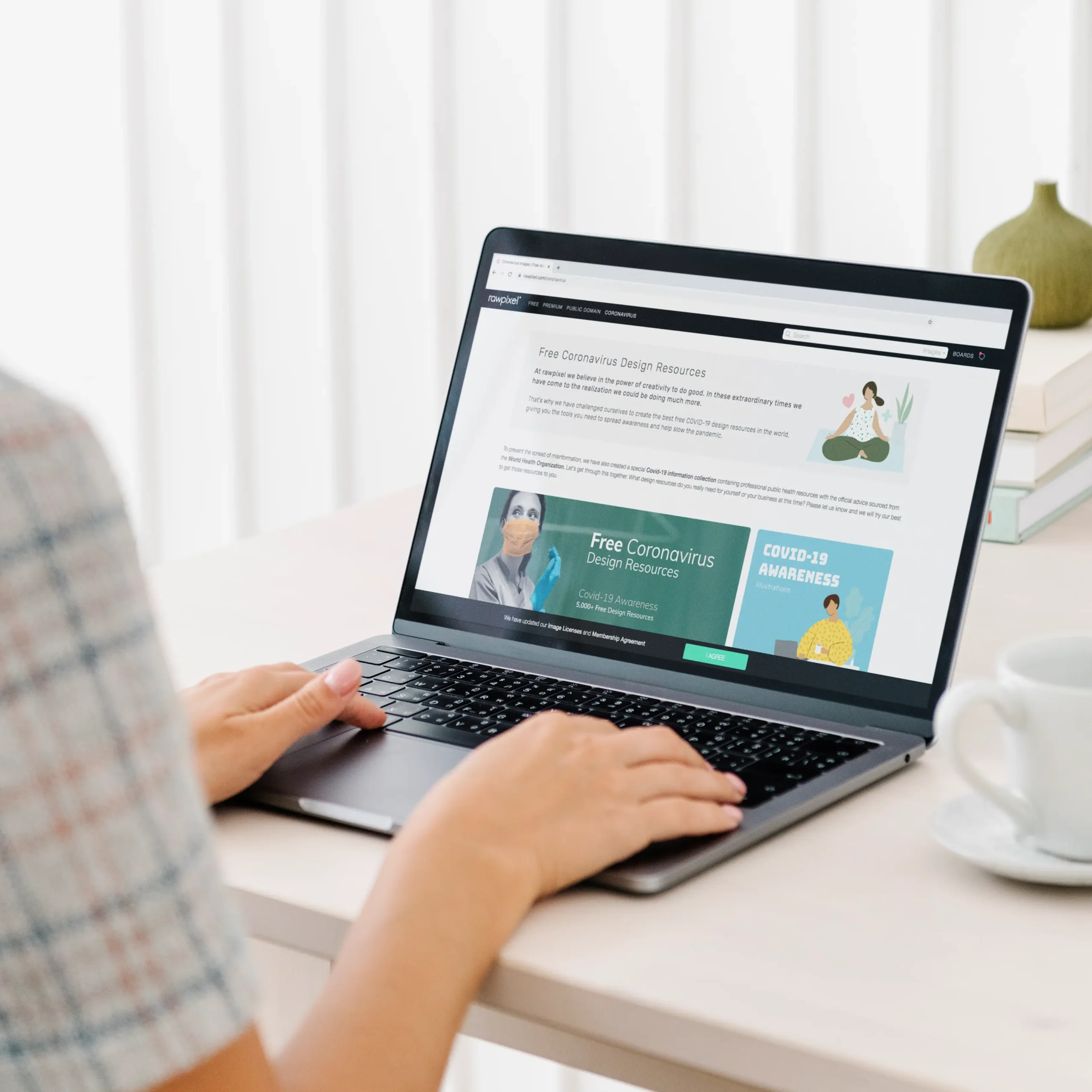An employee using a laptop to surf website